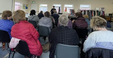 Large group of women attending event for International Women's Day