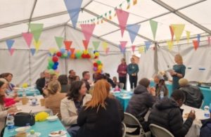 Tent of people attending large cultural event